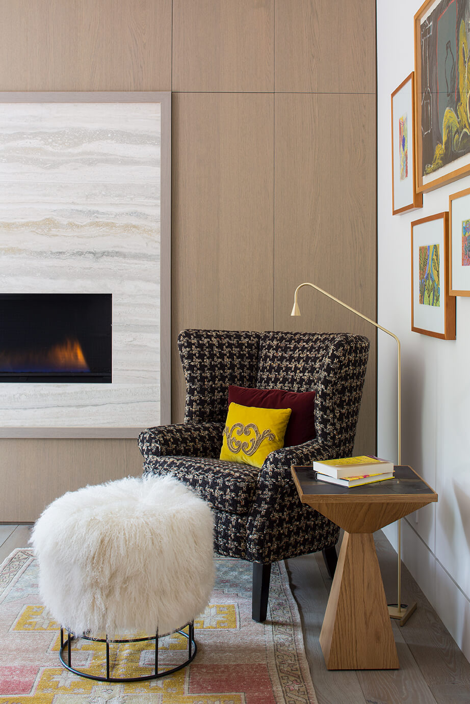 Cute corner area with chair, ottoman and wood panel wall